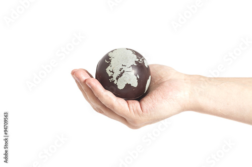 Hand holding Earth isolated on white