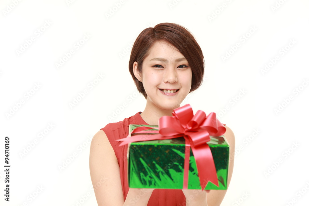 young Japanese woman offering a gift young Japanese woman offering a gift