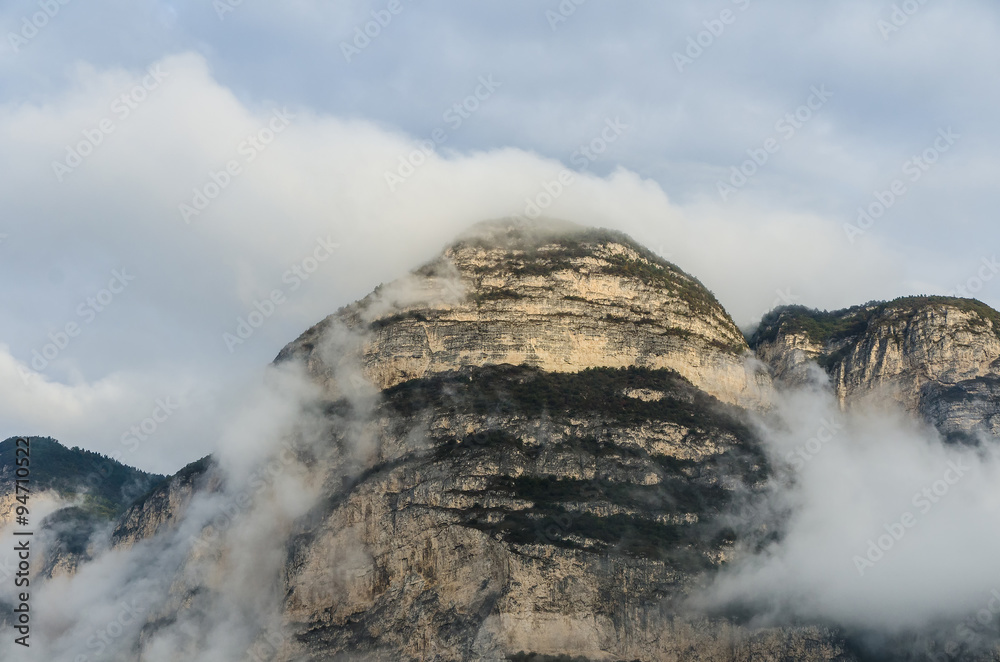 ancient mountain peaks enveloped in clouds ancient mountain peaks enveloped in clouds