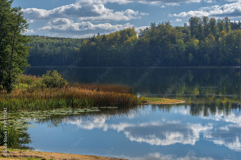 colors surround a small lake near Round Pond