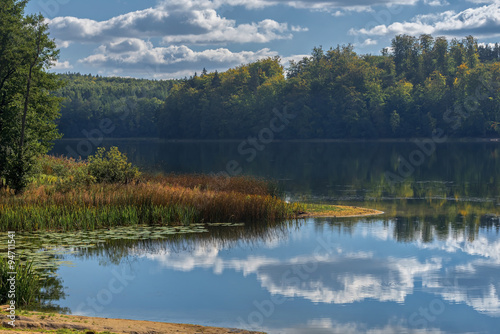 colors surround a small lake near Round Pond