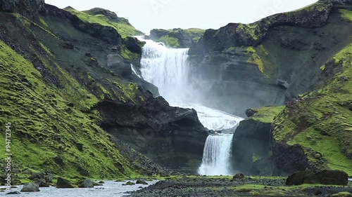 Ofaerufoss waterfall in the Eldgja canyon, in the green, Icelandic highlands. photo