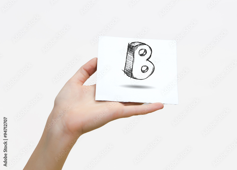 Hand holding a piece of paper with sketchy capital letter B, isolated on white. Hand holding a piece of paper with sketchy capital letter B, isolated on white.