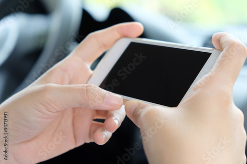 Woman Sitting in the Car and Using Smart Phone