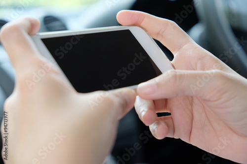 Woman Sitting in the Car and Using Smart Phone