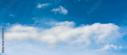 white cumulus clouds in the blue sky for