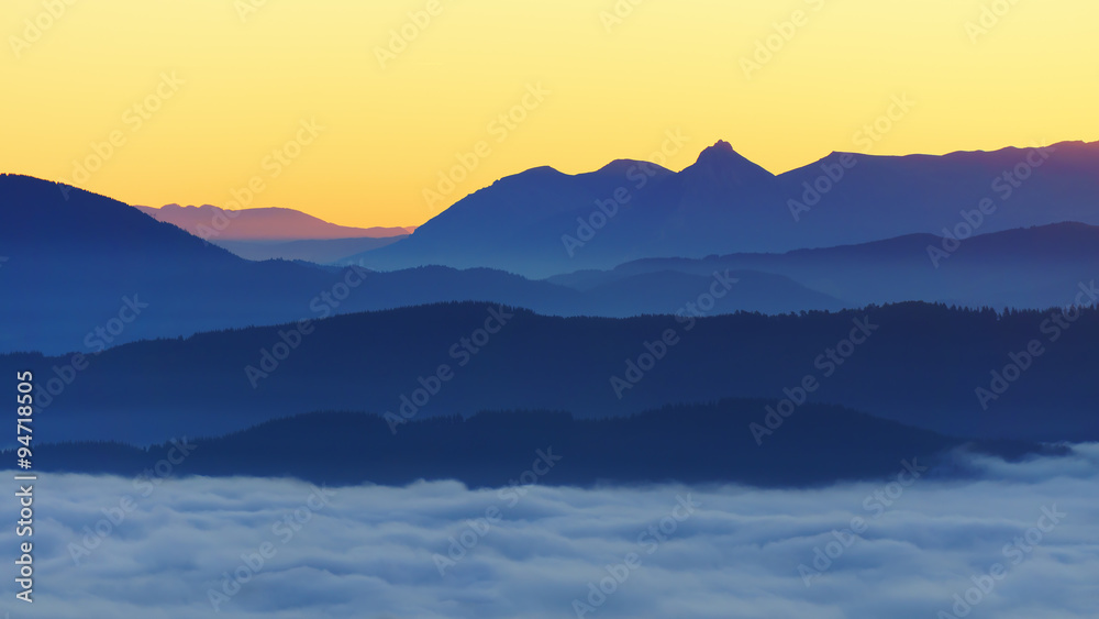 mountains with fog at sunrise