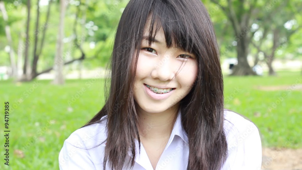 Portrait of thai student teen beautiful girl happy and relax On Park Portrait of thai student teen beautiful girl happy and relax On Park