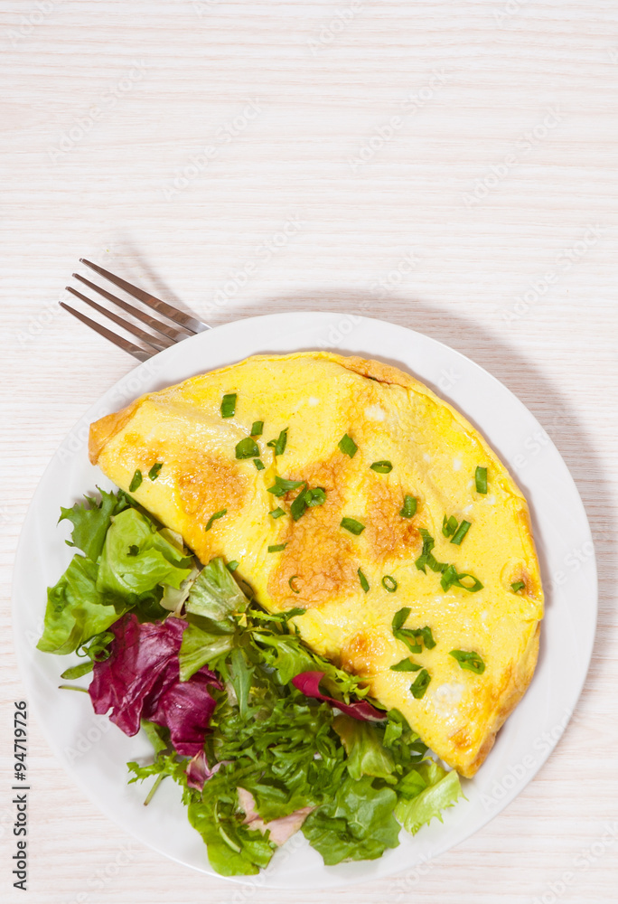 omelet with fresh mixed salad leaves
