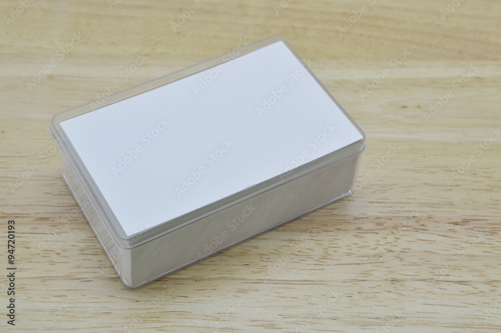 Blank business card inside box on wooden office table Blank business card inside box on wooden office table