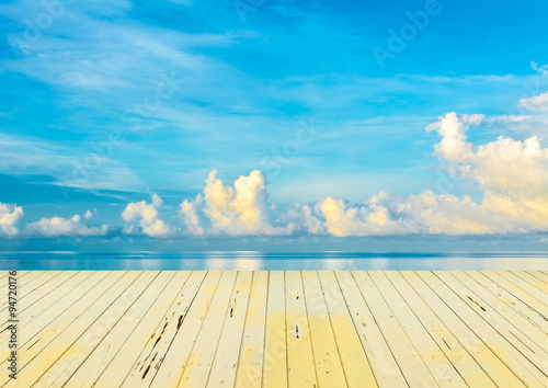 blue sea and cloudy blue sky over it.