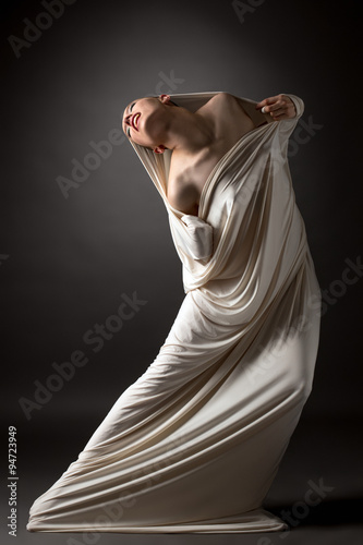 Concept. Beautiful naked girl breaks her cocoon photo