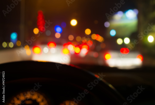 blur image of inside cars with bokeh lights from traffic jam on © coffmancmu