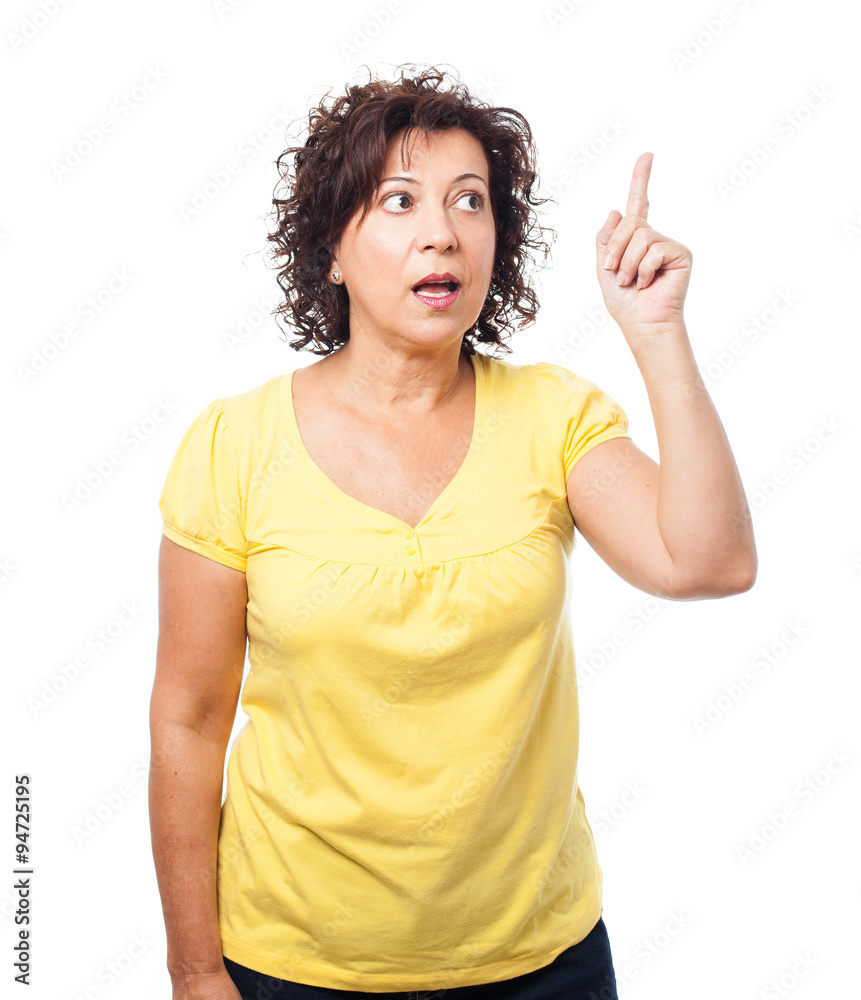 pretty mature woman pointing up with finger pretty mature woman pointing up with finger
