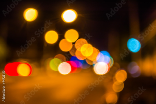 image of blur street bokeh with lights in night time. © coffmancmu
