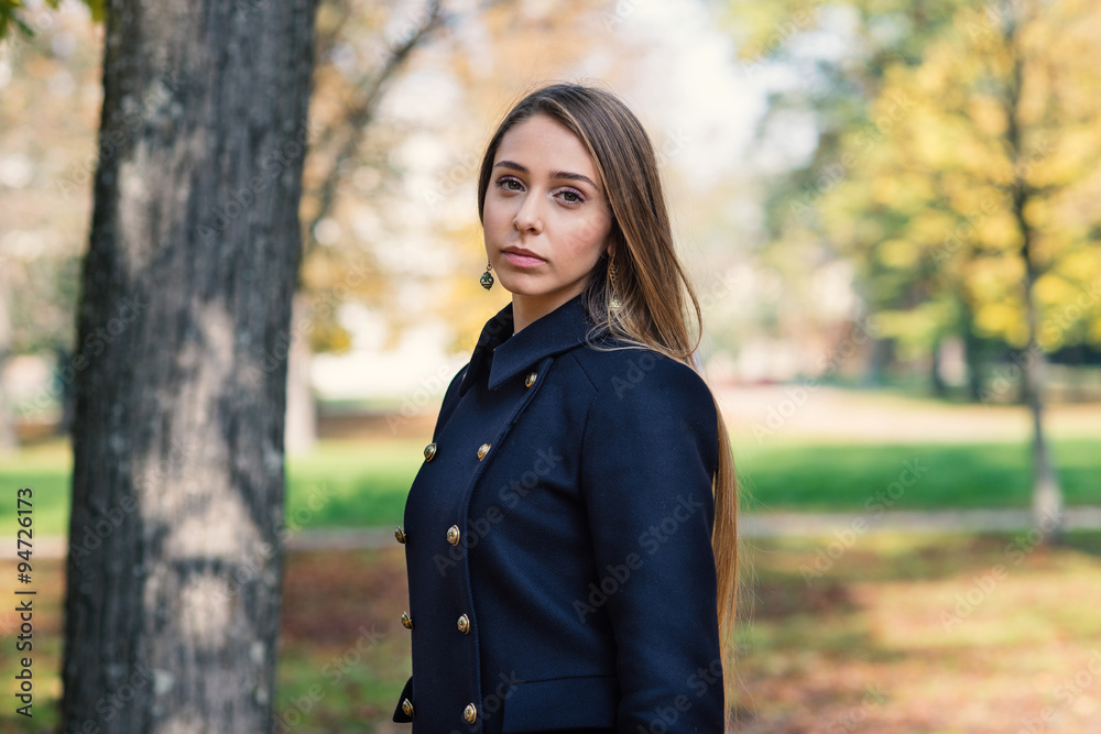 Intimate portrait of young blonde woman outdoors in a park Intimate portrait of young blonde woman outdoors in a park