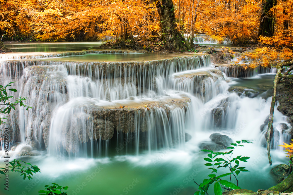 Amazing waterfall in autumn forest 