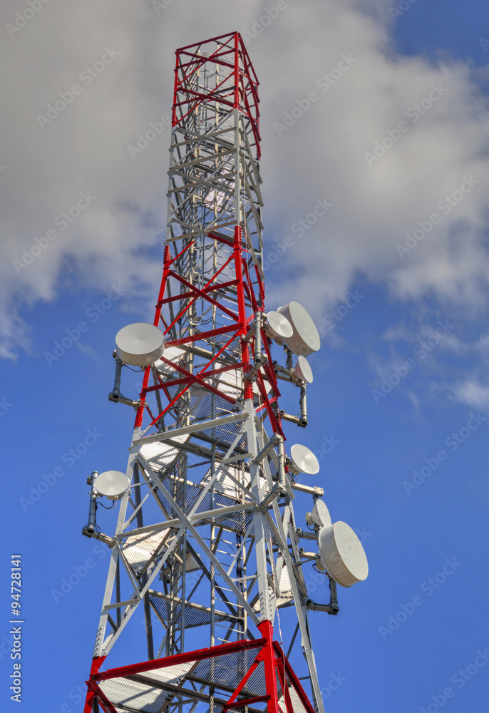 Communication antenna tower on blue sky