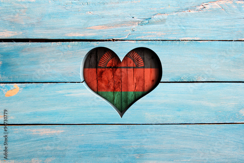 Love Malawi. Heart and flag on a blue wooden board photo