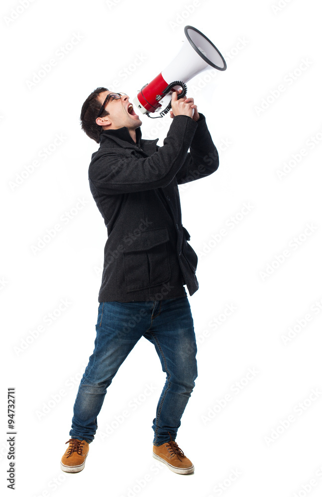 Fototapeta premium full body young man shouting with megaphone