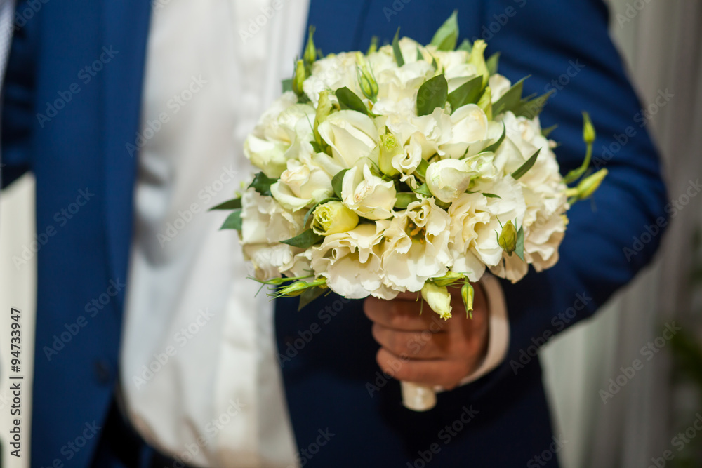 Groom holding wedding bouquet Groom holding wedding bouquet