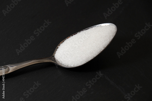 Close-up of granulated sugar in spoon