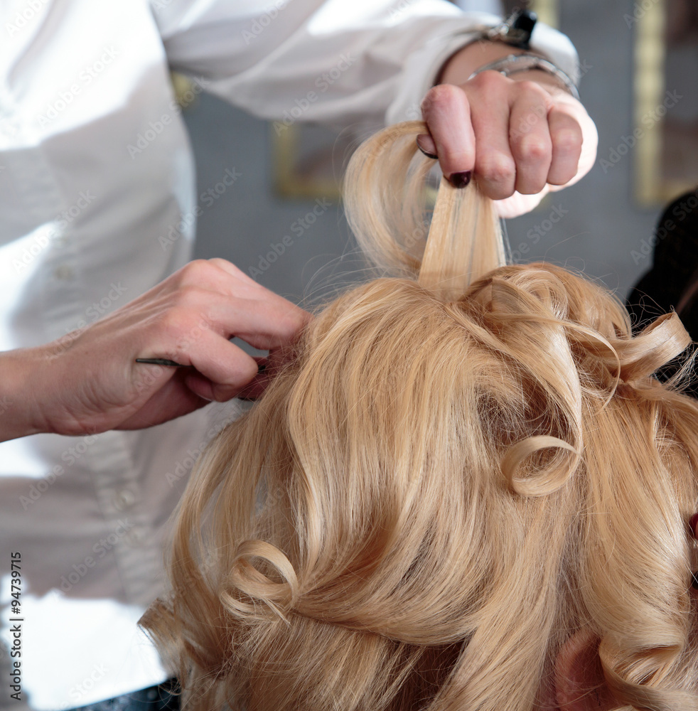 Fototapeta premium Barber makes laying blonde