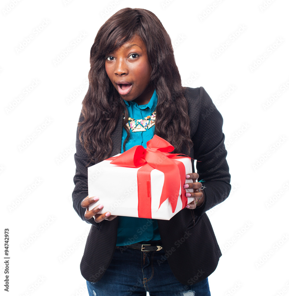happy black woman holding a gift happy black woman holding a gift