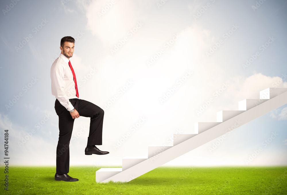 Business person climbing up on white staircase in nature