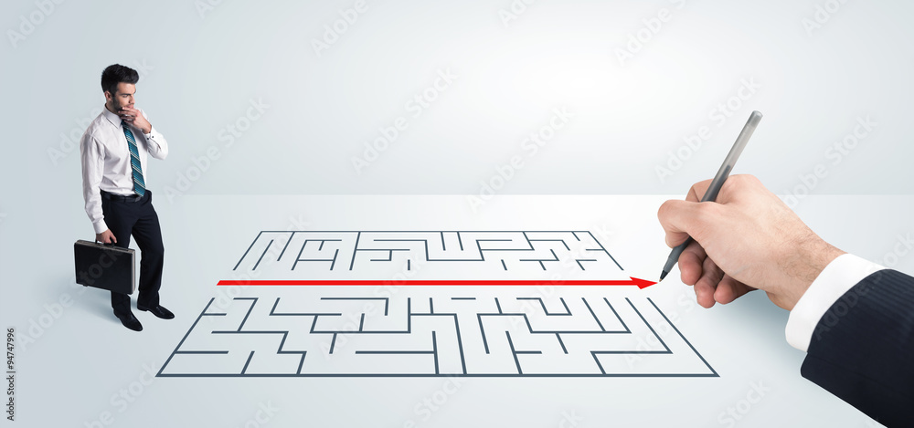 Business man looking at hand drawing solution for maze Business man looking at hand drawing solution for maze