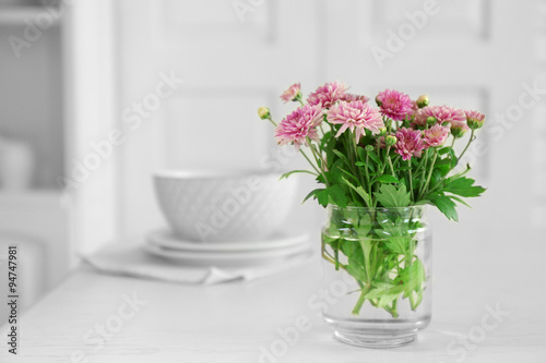 Fototapeta Naklejka Na Ścianę i Meble -  Beautiful flowers in vase on table, on light background