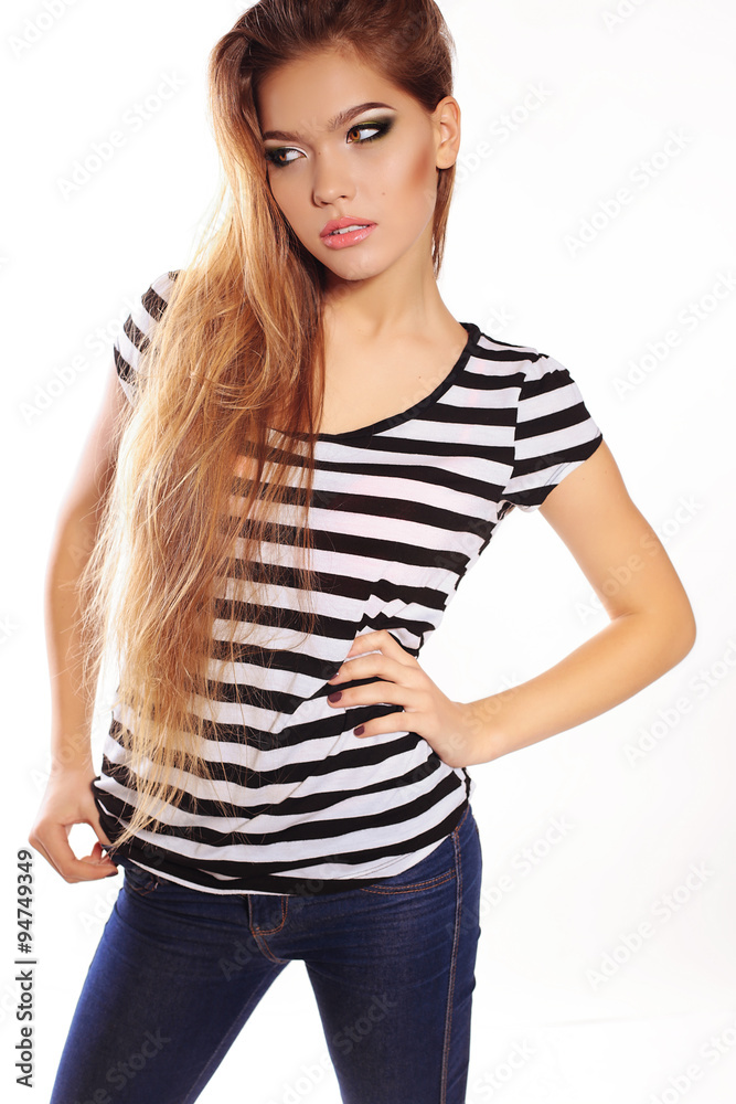 Fototapeta premium woman with long hair and bright makeup wears casual clothes