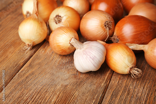 Onion on wooden background