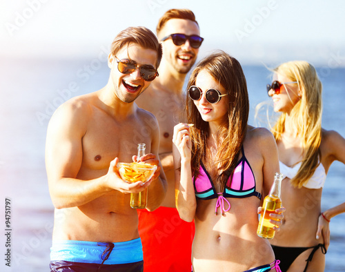 Young people with drinks on...