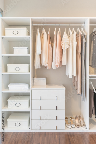 white wardrobe on wooden floor with dress © 290712