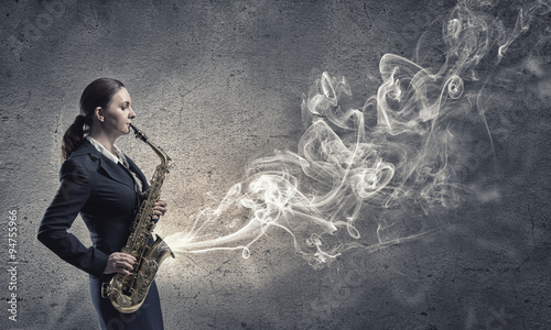Photo Woman saxophonist. Concept image
