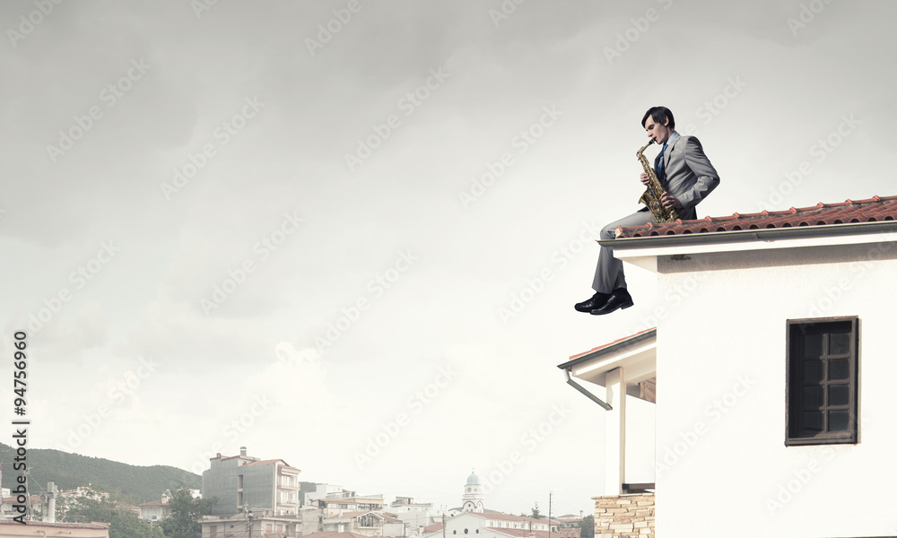 Handsome saxophonist. Concept image Handsome saxophonist. Concept image