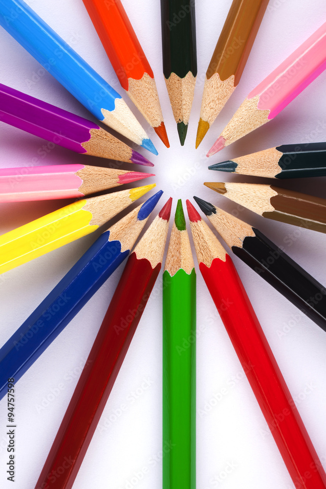 coloring pencils in a circle centered to the right top view shot on a white background coloring pencils in a circle centered to the right top view shot on a white background