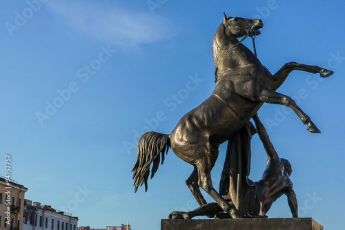Anichkov bridge and sculpture tamer of horses, Saint Petersburg Russia photo