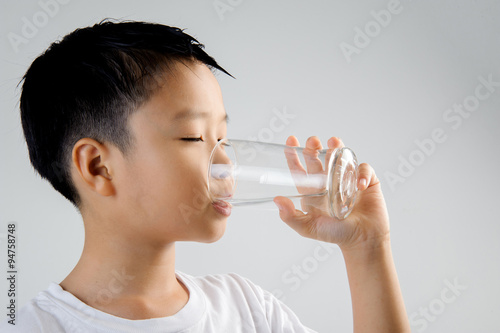 Boy drink water from glass