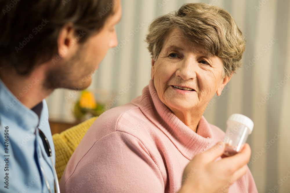 Doctor prescribing senior woman medicament Doctor prescribing senior woman medicament