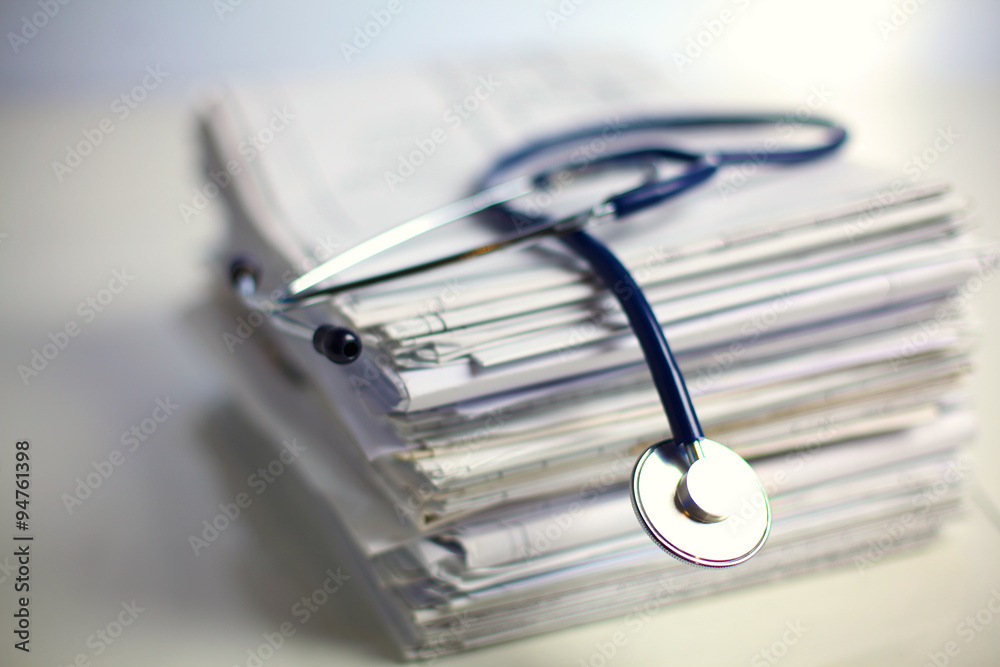 books folder file and stethoscope isolated on white background books folder file and stethoscope isolated on white background