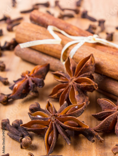 Star anise, cinnamon sticks and cloves on wooden table, seasoning for cooking