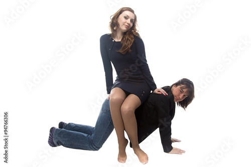 Woman sitting on man in black jacket