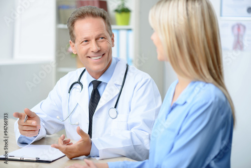 Professional doctor examining his patient  photo