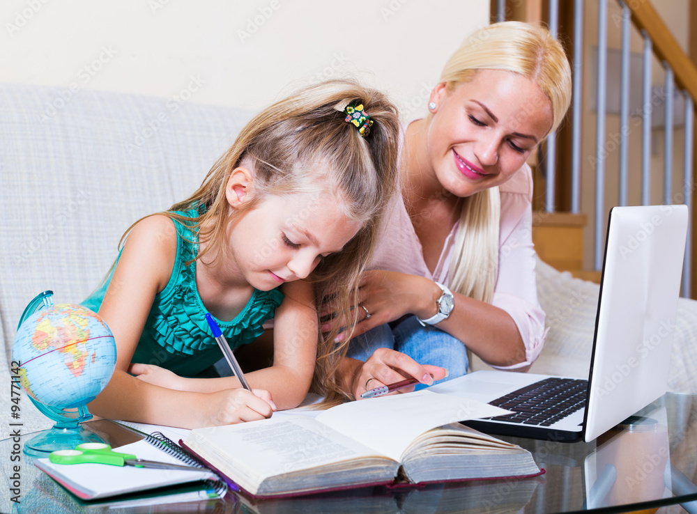 Fototapeta premium Woman and child having lesson