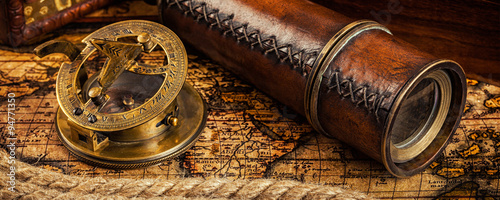 Old vintage compass on ancient map