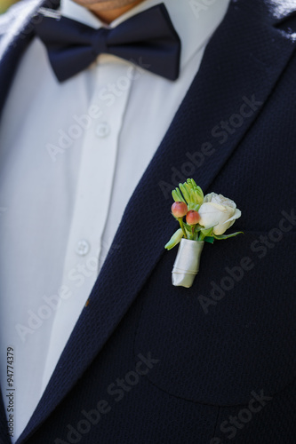 beautiful wedding boutonniere on suit of groom