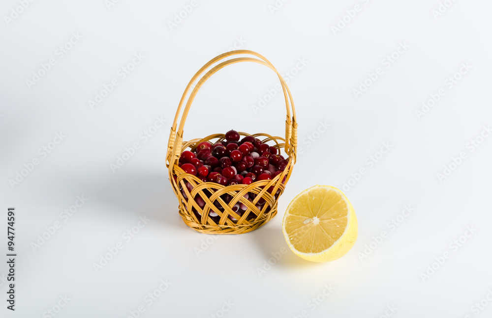 cranberry and lemon isolated on white background