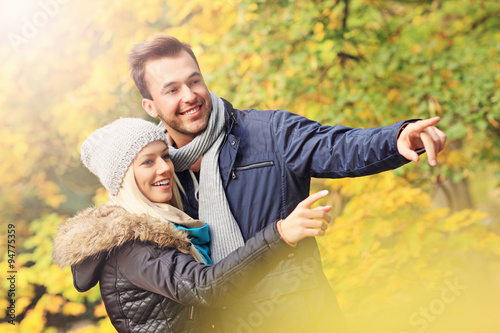 Young romantic couple in the park in autumn